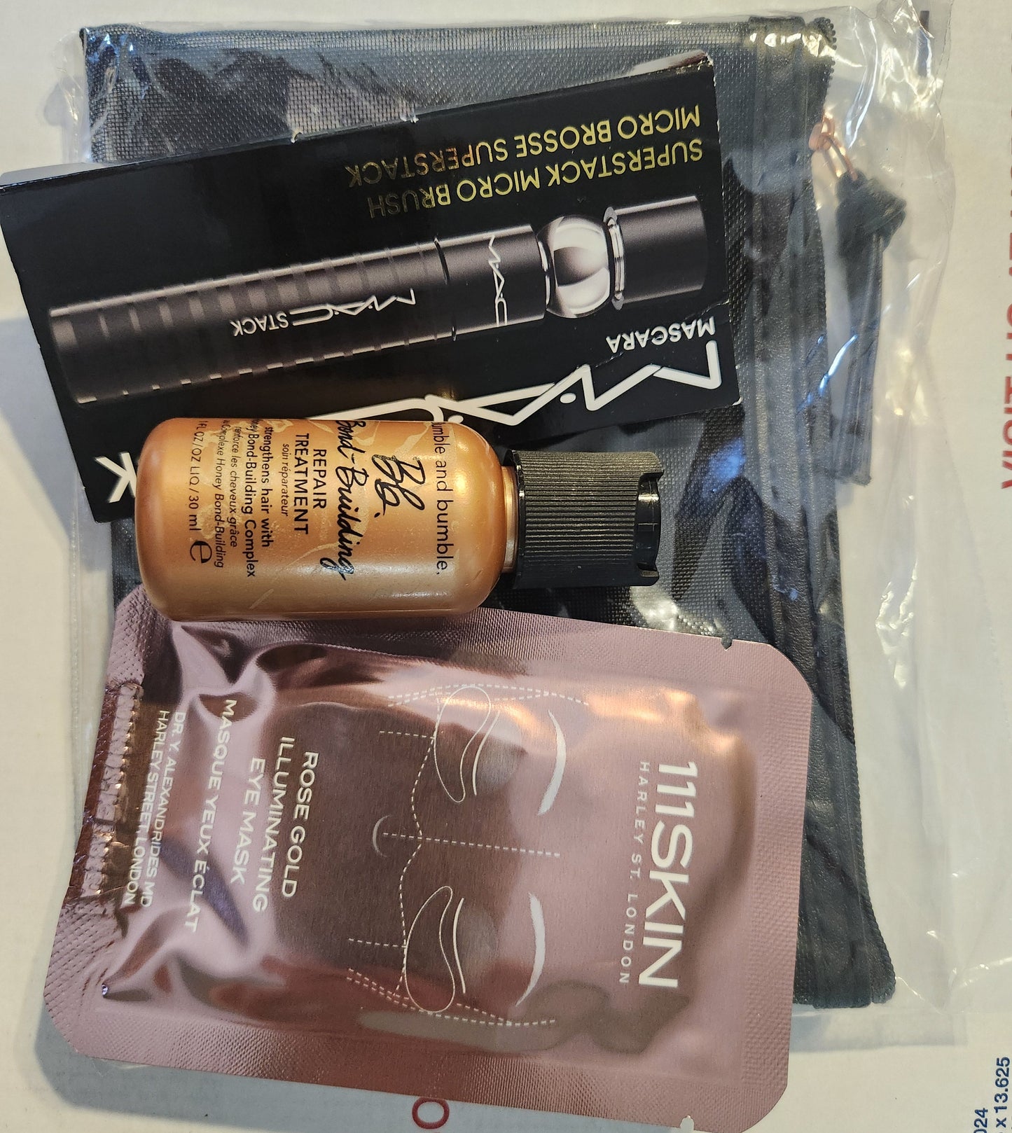 "New Anastasia Beverly Hills mesh makeup bag with luxury beauty samples displayed"