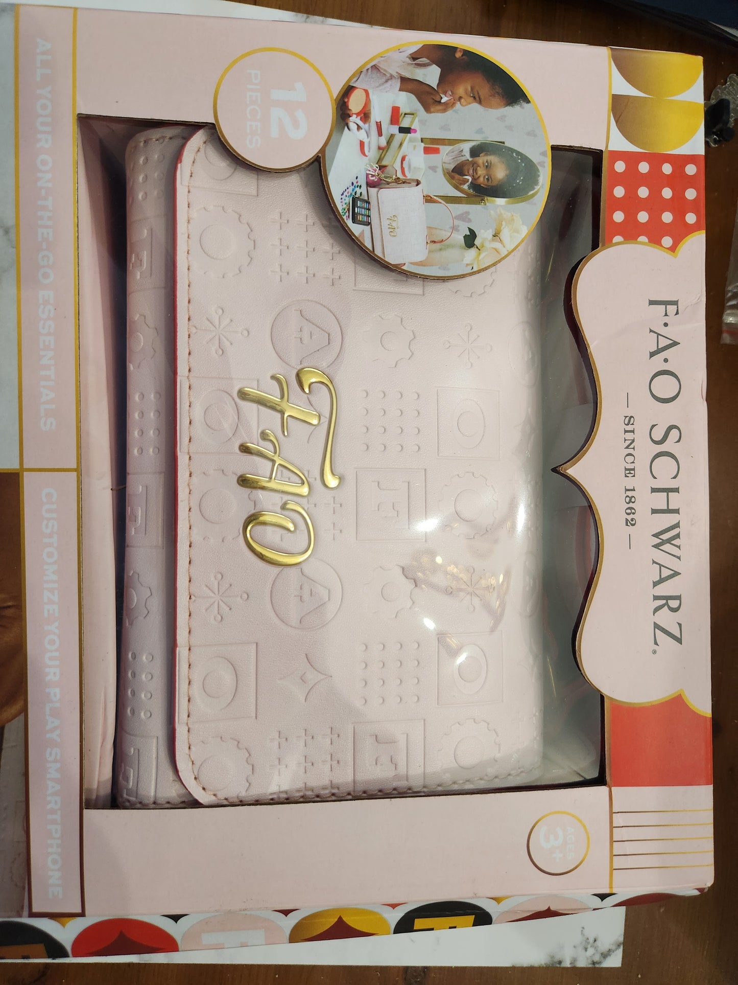 “Close-up of play lipstick, blush, and pretend credit card from FAO Schwarz set”
